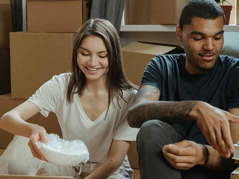 Couple packing up their kitchen items