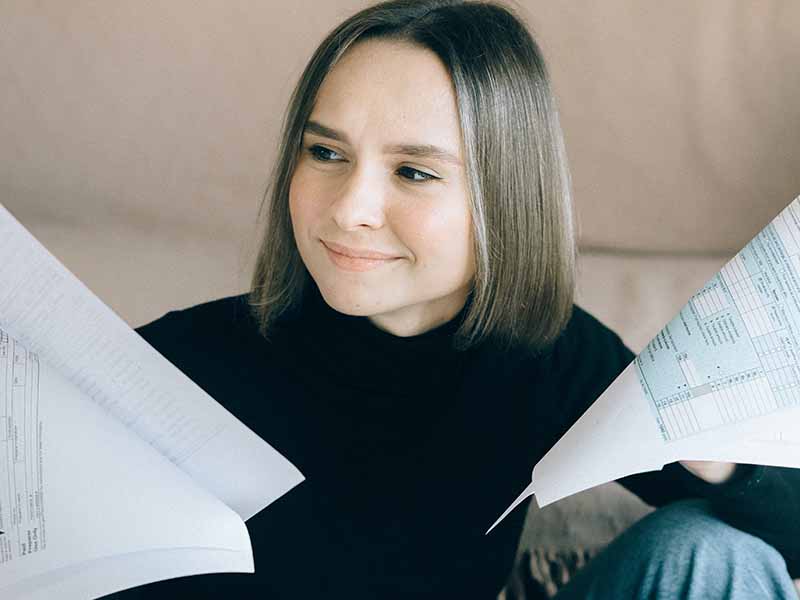 Woman looking at tax papers