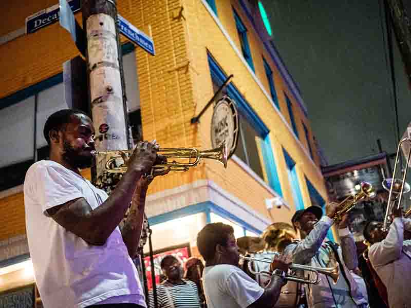 Band playing instruments in the street