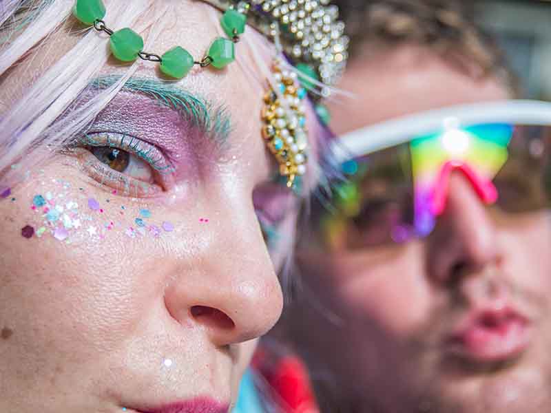 Couple wearing festive clothing for Mardi Gras