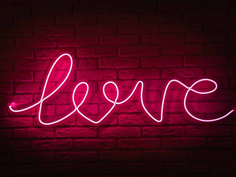 Neon sign that spells the word Love