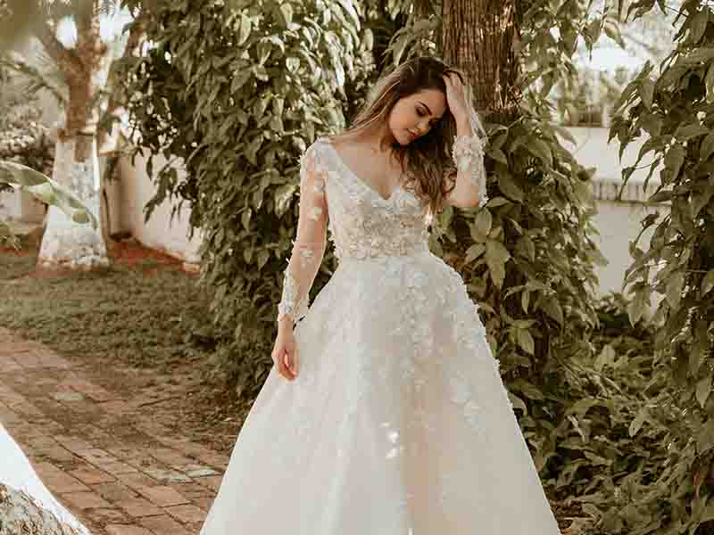 Woman in wedding dress in a garden