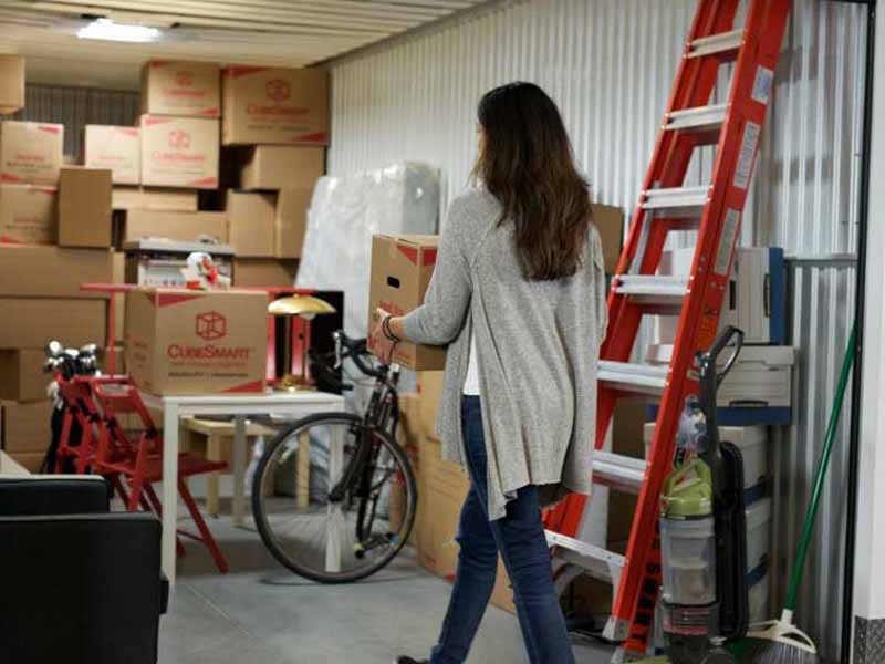 Woman walking into storage unit