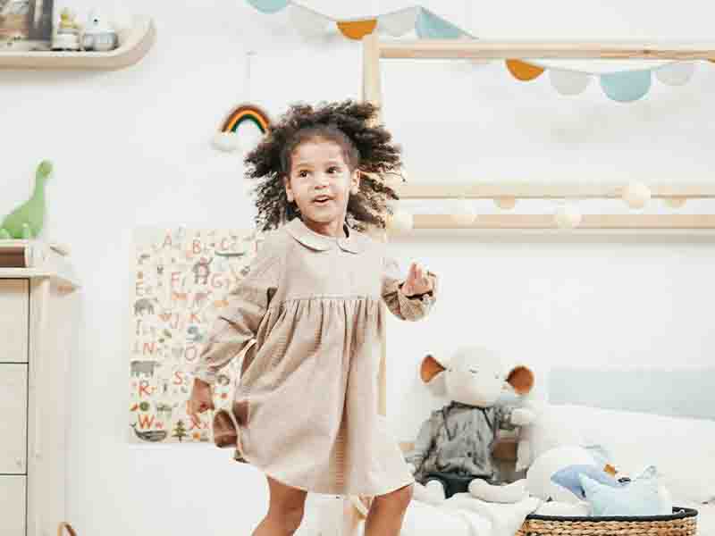 Girl dancing in playroom