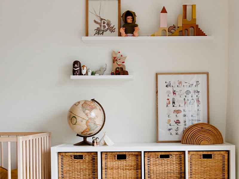 Storage drawers and shelving in a modern nursery.