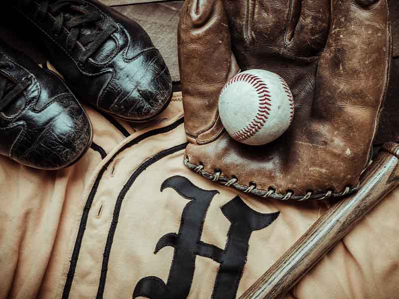 Antique baseball shoes, glove, all and jersey
