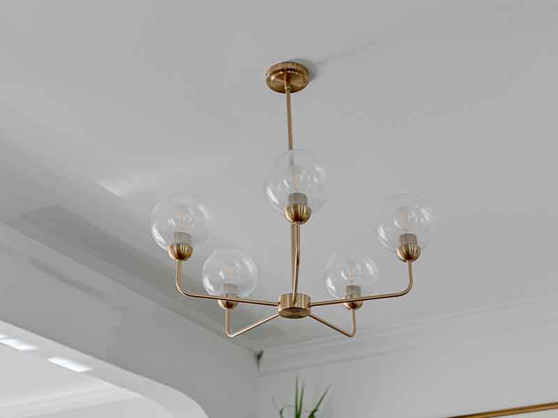 Brass chandelier with glass globes