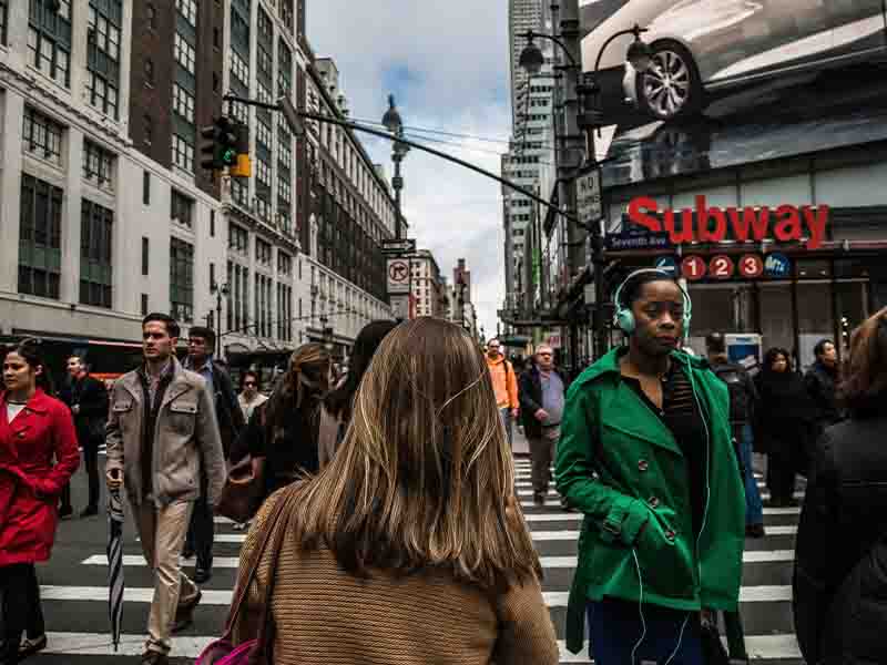 Woman walking through city