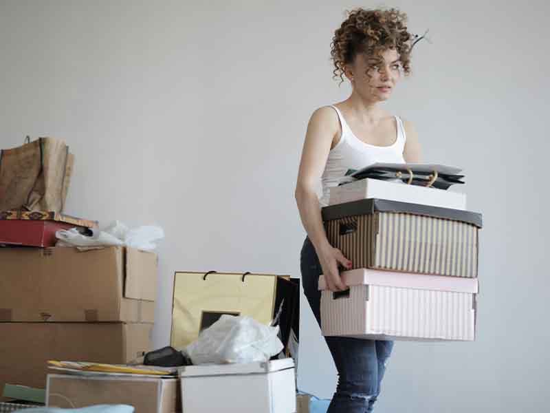 Woman carrying boxes