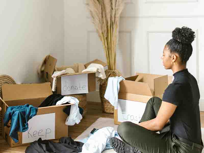 Woman sitting sorting out clothes