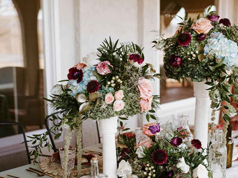 Floral arrangement and food on table