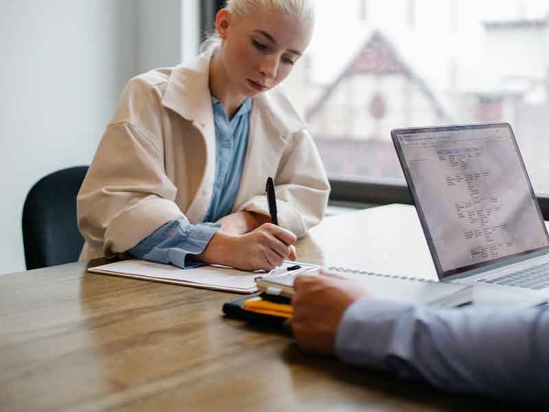 Woman signing contract