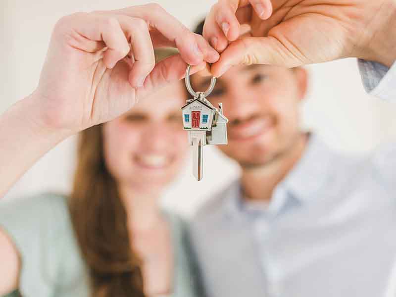Couple holding house keys