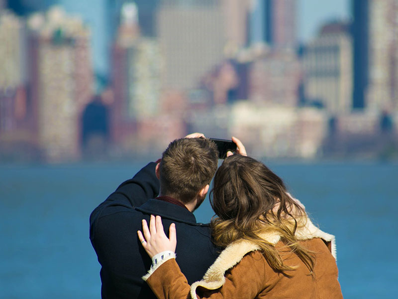 couple taking selfie together on a sunny day