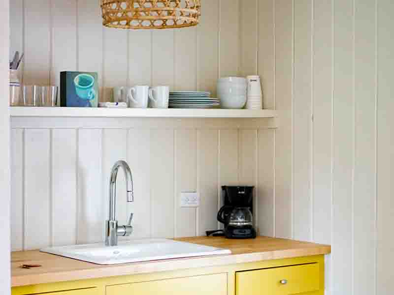 Kitchen with yellow cabinets