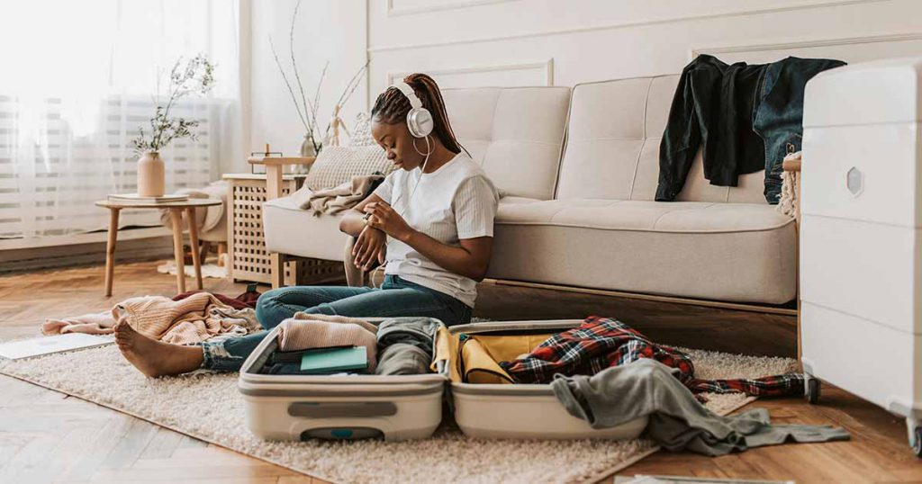 Woman packing suitcase