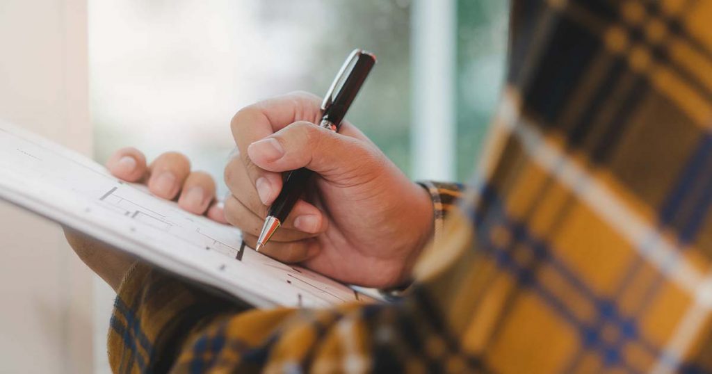 Person writing in a notebook