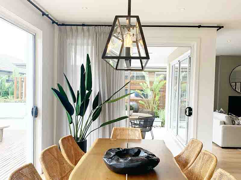 Wooden dining room set with black bowl as center piece