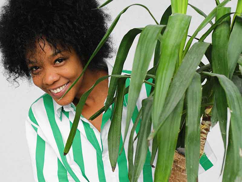 Woman moving plant