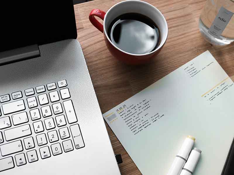 Checklist next to laptop