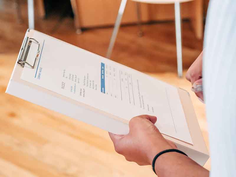 Person holding checklist