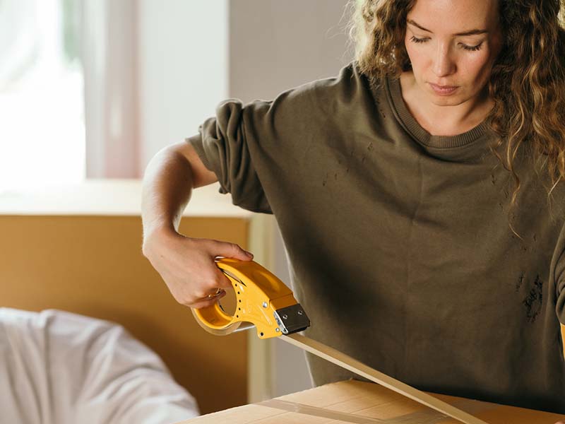 Woman packing boxes