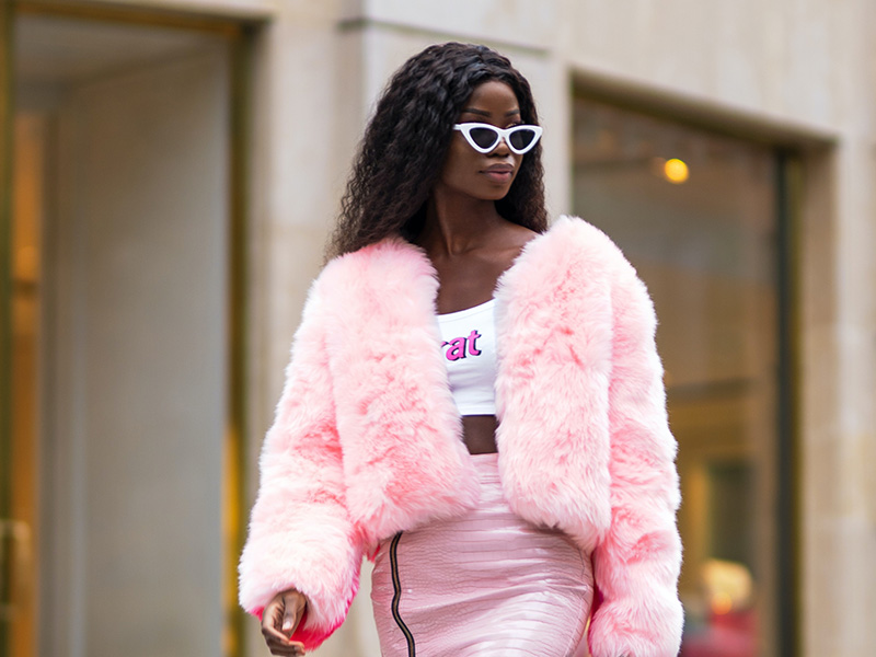 Woman wearing barbie sunglasses and all pink outfit