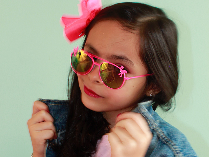 Young girl wearing pink accessories